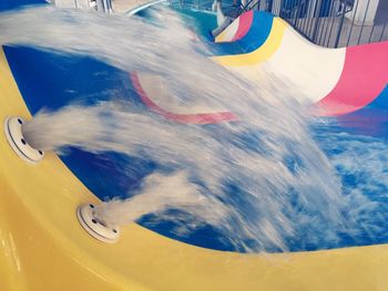 Blurred motion of people at amusement park