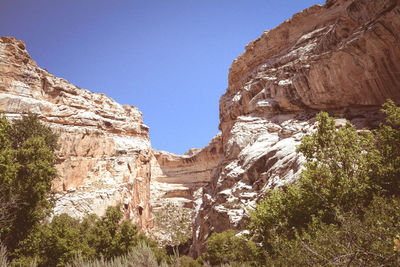 Low angle view of rock formation against clear sky