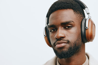 Close-up of young man against white background