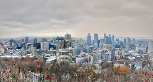 High angle view of buildings in city against sky