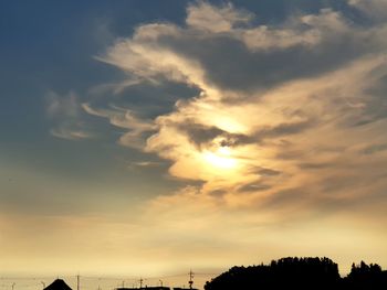 Low angle view of silhouette trees against sky during sunset