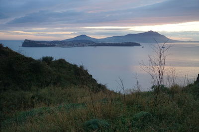 Scenic view of lake against sky during sunset