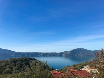 Scenic view of mountains against clear blue sky