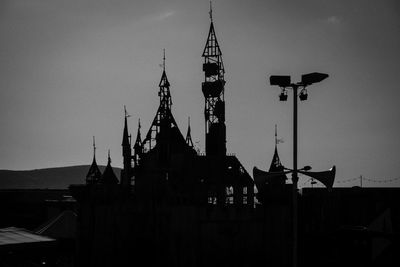 Silhouette of building against sky