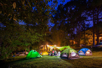 Panoramic view of tent on field at night