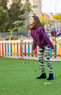 Cute girl standing in park