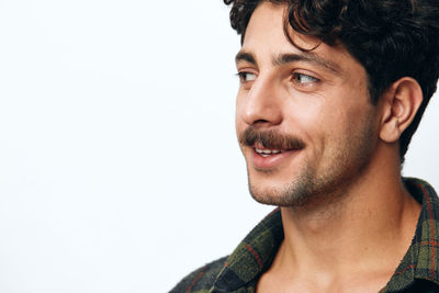 Close-up of young man against white background