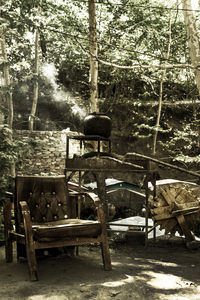 Chairs and table against trees