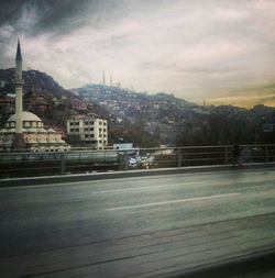 View of buildings against cloudy sky