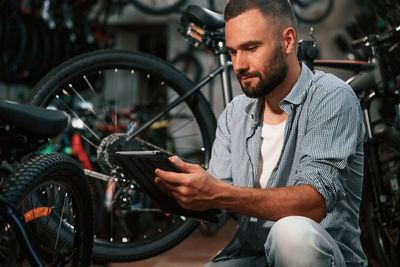 Side view of man using mobile phone