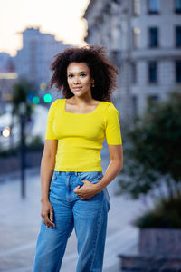 Portrait of smiling woman standing outdoors