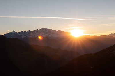 Scenic view of mountains against sky during sunset