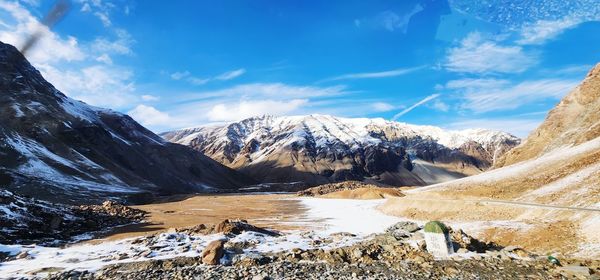 Scenic view of snowcapped mountains against sky