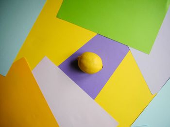 High angle view of multi colored paper on table