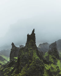 Rock formations on mountain against sky