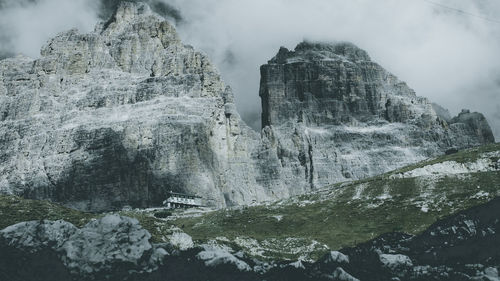Scenic view of waterfall in mountains