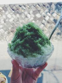 Cropped hand holding ice cream