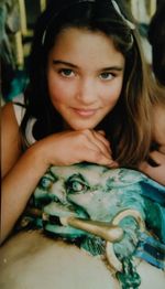 Close-up portrait of smiling young woman