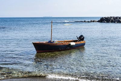 Nautical vessel on sea against sky