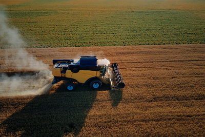 Harvester on field