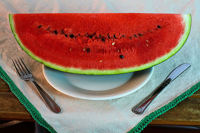 High angle view of fruits in plate on table