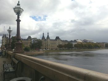 Eiffel tower against cloudy sky