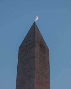 Low angle view of building against blue sky