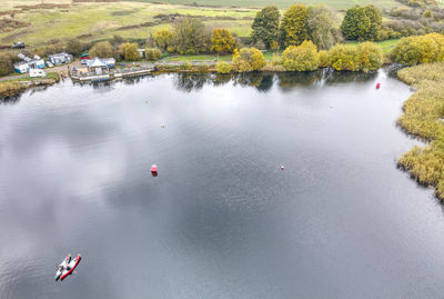 High angle view of trees by lake