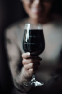 Close-up of man holding glass