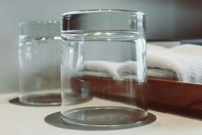 Close-up of empty glass jars on table