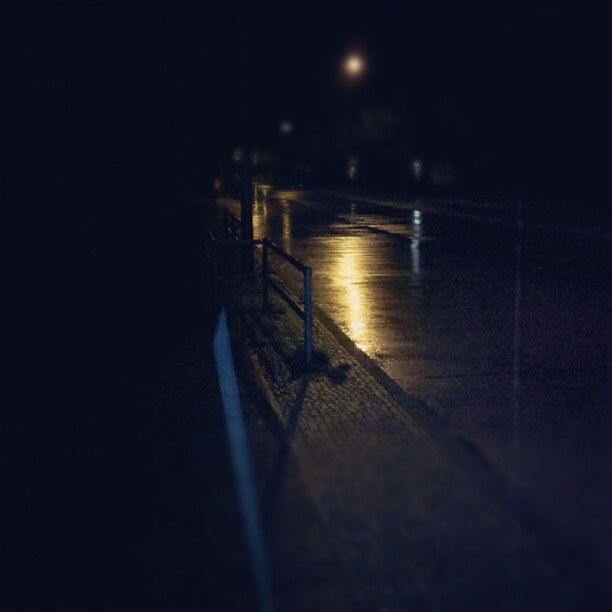 night, illuminated, water, dark, the way forward, copy space, built structure, reflection, lighting equipment, architecture, no people, railing, indoors, surface level, light - natural phenomenon, transportation, wall - building feature, street, empty