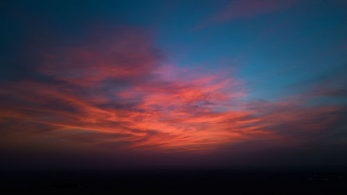 Scenic view of dramatic sky during sunset