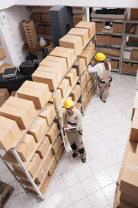 High angle view of people walking on floor