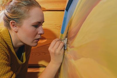 Young woman painting