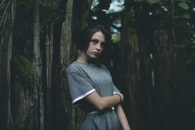 Portrait of young woman standing outdoors