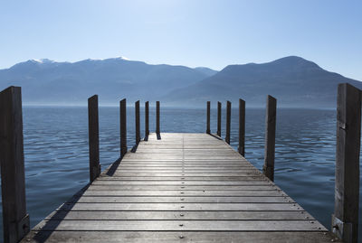 Pier over sea against clear sky