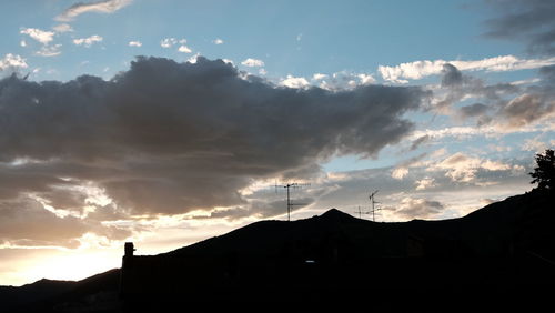 Low angle view of cloudy sky at sunset