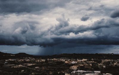 Storm clouds over city