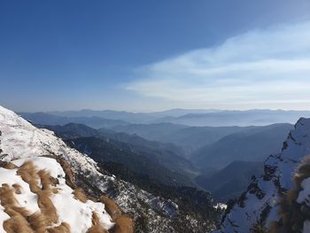 Scenic view of mountains against sky during winter