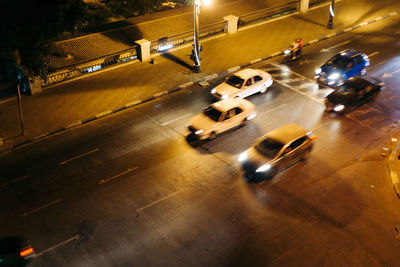 High angle view of cars on road at night