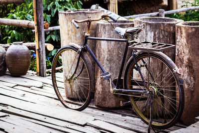 Bicycle parked on wood