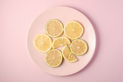 Directly above shot of fruits in glass over white background