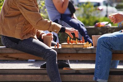 People playing chess outdoors