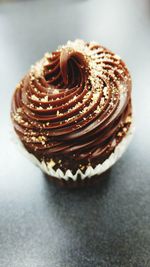 Close-up of pastry over white background