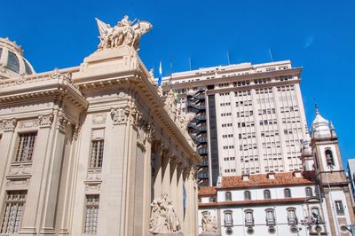 Low angle view of historical building against blue sky