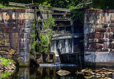 Abandoned building by lake