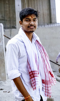 Portrait of young man standing outdoors