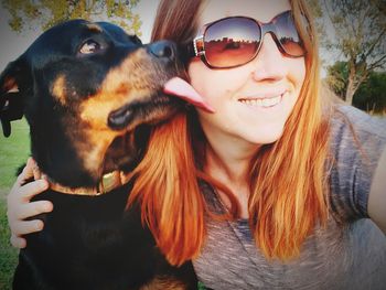 Portrait of teenage girl with dog