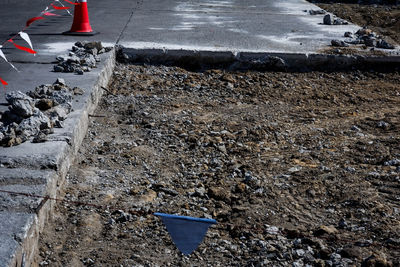 Low section of person by puddle on road