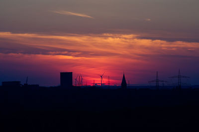 Silhouette of building during sunset